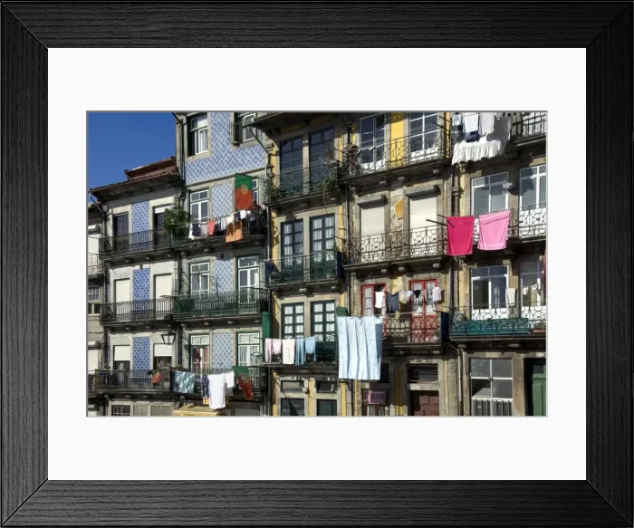 Framed Print : A residential street in the old town with traditional wrought iron balconies, blue and white tiled panels on the outside walls, washing hanging in the sun, Oporto, Portiugal, Europe Framed Print : A residential street in the old town with traditional wrought iron balconies, blue and white tiled panels on the outside walls, washing hanging in the sun, Oporto, Portiugal, Europe