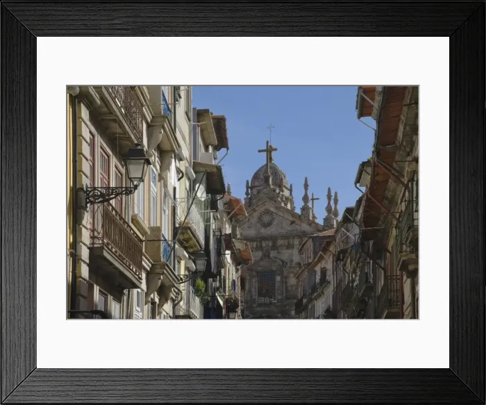 Framed Print : A church dominates a narrow street in the old town, Oporto, Portugal, Europe Framed Print : A church dominates a narrow street in the old town, Oporto, Portugal, Europe