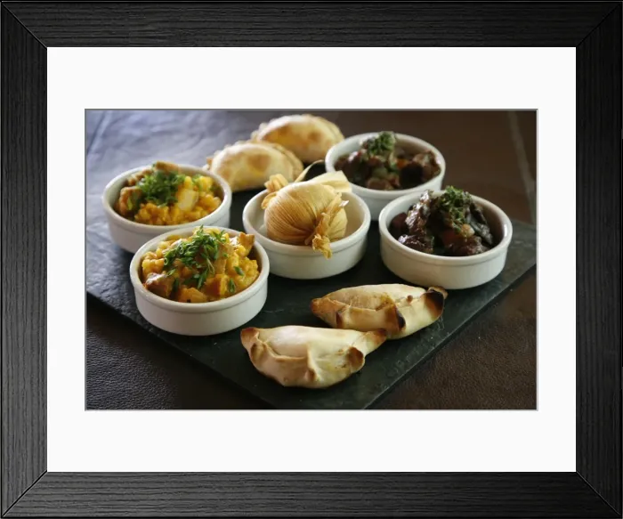 Framed Print : A tray with traditional food from the northwest, including empanadas, locro and humitas, at the restaurant of La Comrca Hotel in Purmamarca, Jujuy Province, Argentina, South America Framed Print : A tray with traditional food from the northwest, including empanadas, locro and humitas, at the restaurant of La Comrca Hotel in Purmamarca, Jujuy Province, Argentina, South America