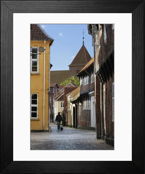 Framed Print : Cobblestone alley in the old town with tower of St. Catharinae Kirke, Ribe, Jutland, Denmark, Scandinavia, Europe Framed Print : Cobblestone alley in the old town with tower of St. Catharinae Kirke, Ribe, Jutland, Denmark, Scandinavia, Europe