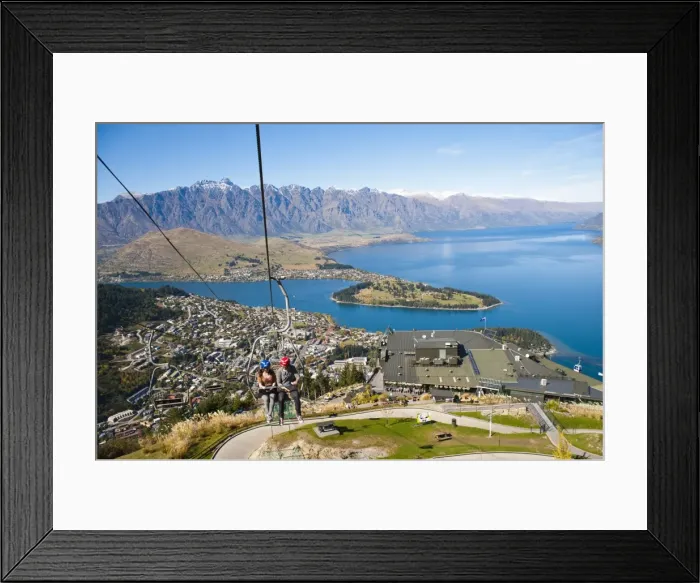 Framed Print : Two tourists on the gondola to the luge track above Queenstown, Otago, South Island, New Zealand, Pacific Framed Print : Two tourists on the gondola to the luge track above Queenstown, Otago, South Island, New Zealand, Pacific