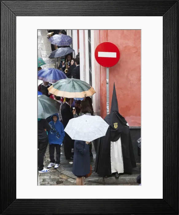 Framed Print : Penitent during Semana Santa (Holy Week) along rainy street, Seville, Andalucia, Spain, Europe Framed Print : Penitent during Semana Santa (Holy Week) along rainy street, Seville, Andalucia, Spain, Europe