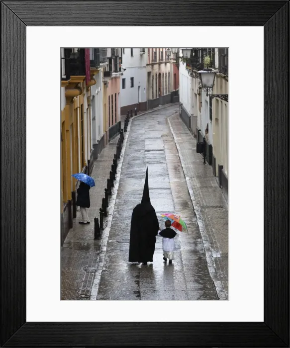Framed Print : Penitents during Semana Santa (Holy Week) along rainy street, Seville, Andalucia, Spain, Europe Framed Print : Penitents during Semana Santa (Holy Week) along rainy street, Seville, Andalucia, Spain, Europe