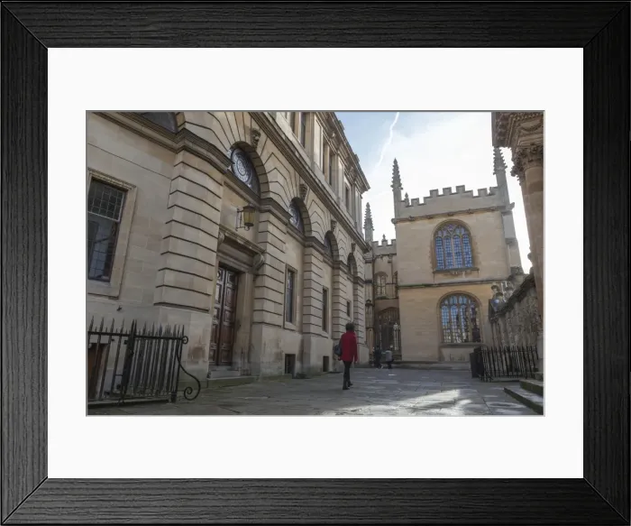 Framed Print : Wandering past the Sheldonian Theatre towards the Bodleian Library, Oxford, Oxfordshire, England, United Kingdom, Europe Framed Print : Wandering past the Sheldonian Theatre towards the Bodleian Library, Oxford, Oxfordshire, England, United Kingdom, Europe