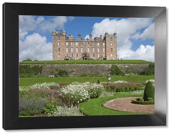 The 17th century Renaissance Drumlanrig Castle (Pink Palace) built by the 1st Duke of Queensberry, William Douglass, from the lower garden terrace, Dumfries and Galloway, Scotland, United Kingdom, Europe