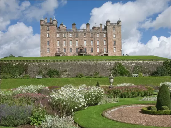 The 17th century Renaissance Drumlanrig Castle (Pink Palace) built by the 1st Duke of Queensberry, William Douglass, from the lower garden terrace, Dumfries and Galloway, Scotland, United Kingdom, Europe