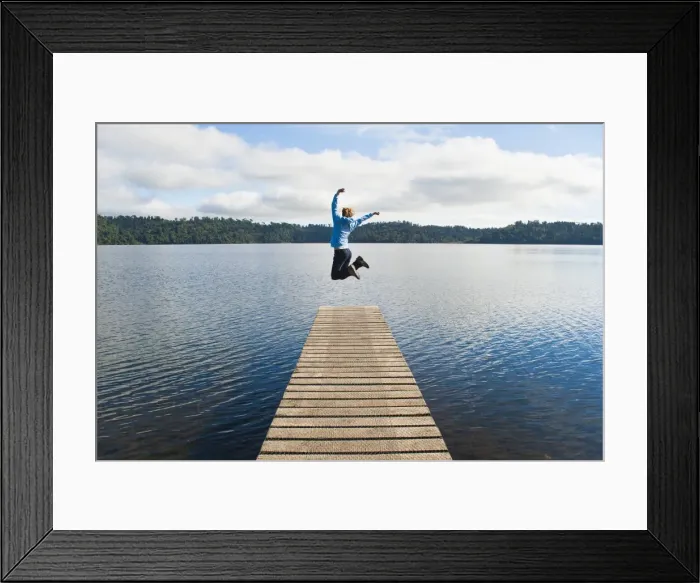 Framed Print : Woman jumping on a jetty at Lake Ianthe, West Coast, South Island, New Zealand, Pacific Framed Print : Woman jumping on a jetty at Lake Ianthe, West Coast, South Island, New Zealand, Pacific