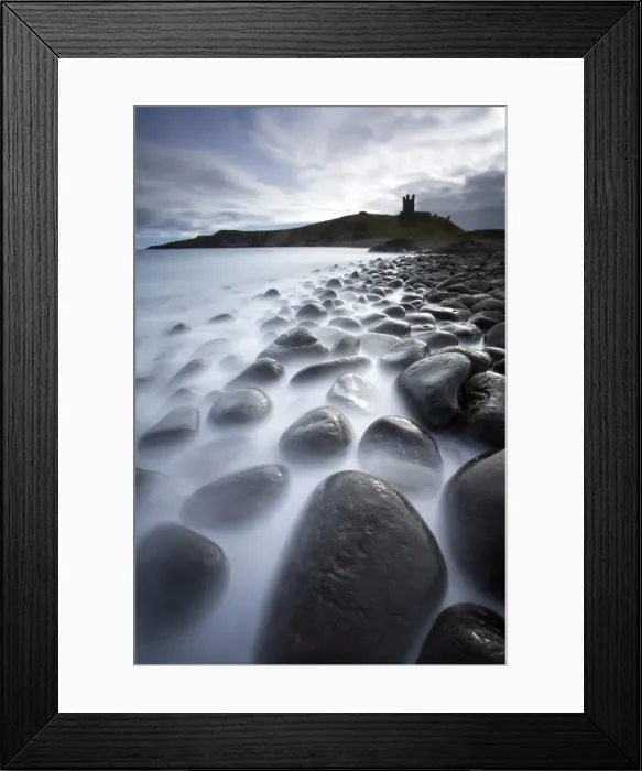Framed Print : Long exposure to record motion in the sea as it washes around black basalt boulders on a beach at Embleton Bay with the silhouette of Dunstanburgh Castle in the distance, Embleton Bay, near Alnwick, Northumberland, England, United Kingdom, Europe Framed Print : Long exposure to record motion in the sea as it washes around black basalt boulders on a beach at Embleton Bay with the silhouette of Dunstanburgh Castle in the distance, Embleton Bay, near Alnwick, Northumberland, England, United Kingdom, Europe
