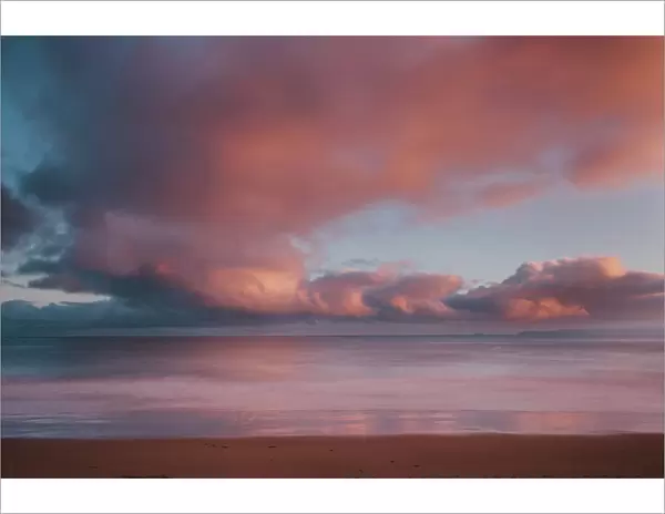 Dawn sky over Carbis Bay beach looking to Godrevy point, St. Ives, Cornwall, England, UK, Europe. Long exposure