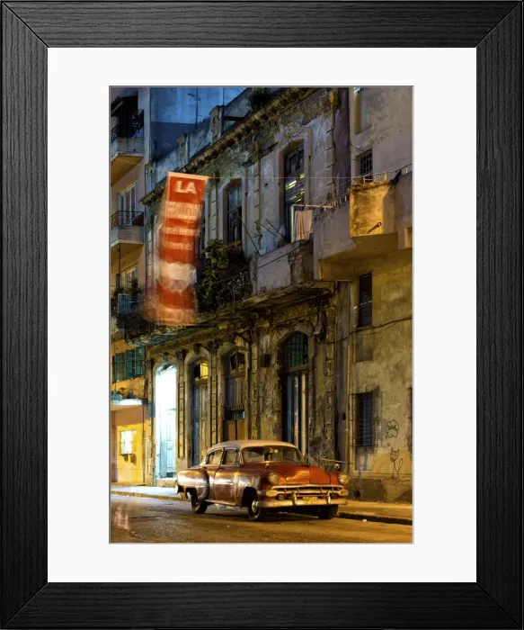 Framed Print : Street scene at night lit by artificial lighting with vintage American car and fluttering revolutionary banner, Havana Centro, Havana, Cuba, West Indies, Central America Framed Print : Street scene at night lit by artificial lighting with vintage American car and fluttering revolutionary banner, Havana Centro, Havana, Cuba, West Indies, Central America