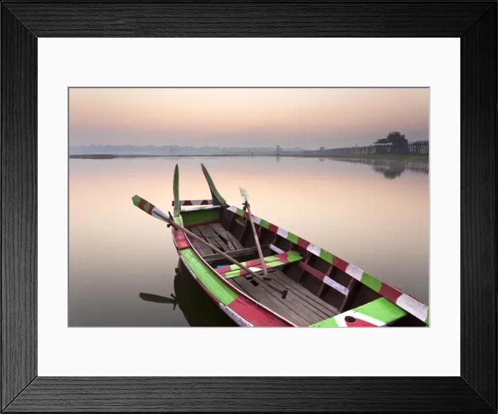 Framed Print : Traditional rowing boat moored on the edge of flat calm Taungthaman Lake at dawn with the colours of the sky reflecting in the calm water, close to the famous U Bein teak bridge, near Mandalay, Myanmar (Burma), Asia Framed Print : Traditional rowing boat moored on the edge of flat calm Taungthaman Lake at dawn with the colours of the sky reflecting in the calm water, close to the famous U Bein teak bridge, near Mandalay, Myanmar (Burma), Asia