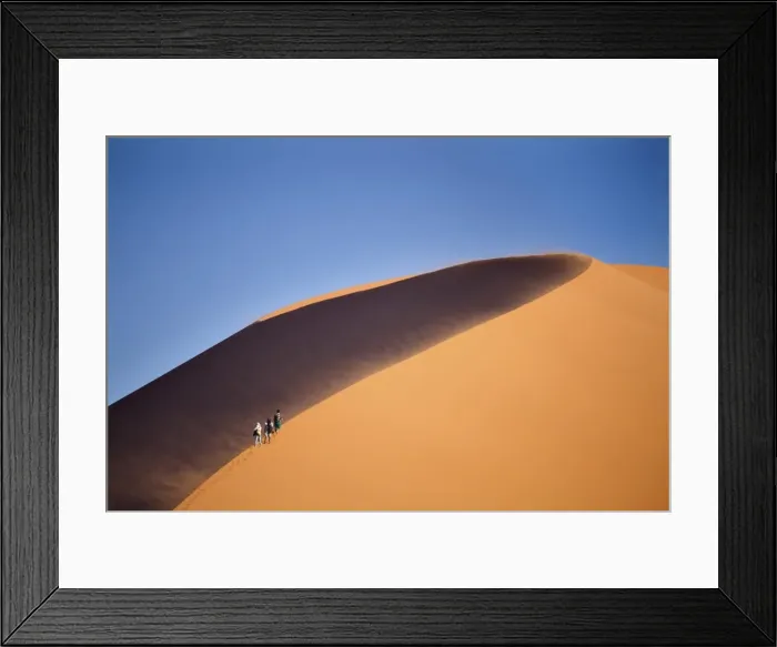 Framed Print : Tourists walking up the snaking ridge of Elim Dune against blue sky, Namib Desert near Sesriem, Namib Naukluft Park, Namibia, Africa Framed Print : Tourists walking up the snaking ridge of Elim Dune against blue sky, Namib Desert near Sesriem, Namib Naukluft Park, Namibia, Africa