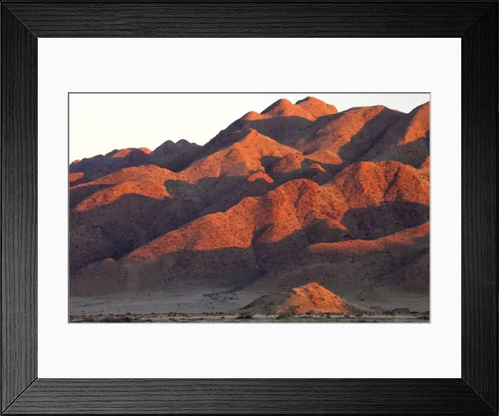 Framed Print : Sandstone mountains lit by the last rays of light from the setting sun, near Sesriem, Namib Desert, Namib Naukluft Park, Namibia, Africa Framed Print : Sandstone mountains lit by the last rays of light from the setting sun, near Sesriem, Namib Desert, Namib Naukluft Park, Namibia, Africa