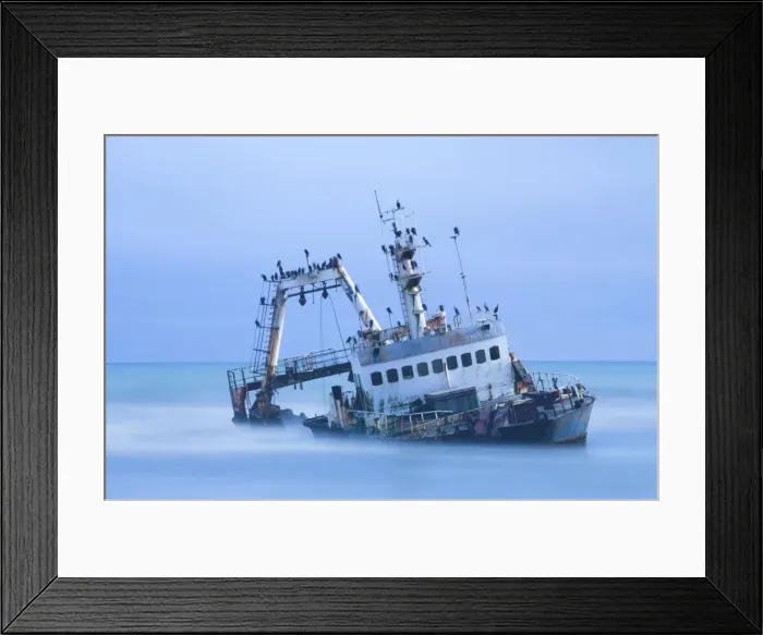 Framed Print : Shipwreck off the Atlantic coast, shot with long exposure to record motion in sea and sky, near Walvis Bay, Namibia, Africa Framed Print : Shipwreck off the Atlantic coast, shot with long exposure to record motion in sea and sky, near Walvis Bay, Namibia, Africa