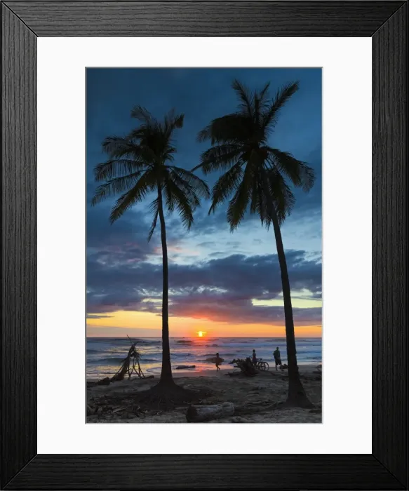 Framed Print : Surfer and palm trees at sunset on Playa Guiones surf beach at sunset, Nosara, Nicoya Peninsula, Guanacaste Province, Costa Rica Framed Print : Surfer and palm trees at sunset on Playa Guiones surf beach at sunset, Nosara, Nicoya Peninsula, Guanacaste Province, Costa Rica
