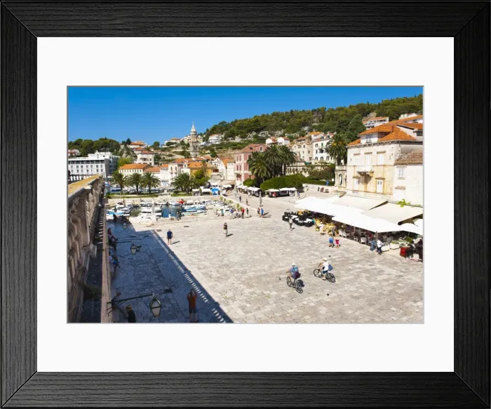 Framed Print : Cafes and tourists in St. Stephens Square, Hvar Town, Hvar Island, Dalmatian Coast, Croatia, Europe Framed Print : Cafes and tourists in St. Stephens Square, Hvar Town, Hvar Island, Dalmatian Coast, Croatia, Europe