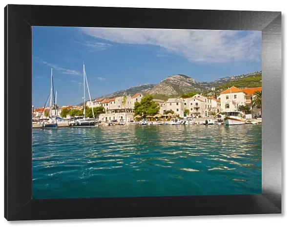Bol Town and the crystal clear Adriatic Sea off Brac Island, Dalmatian Coast, Adriatic, Croatia, Europe