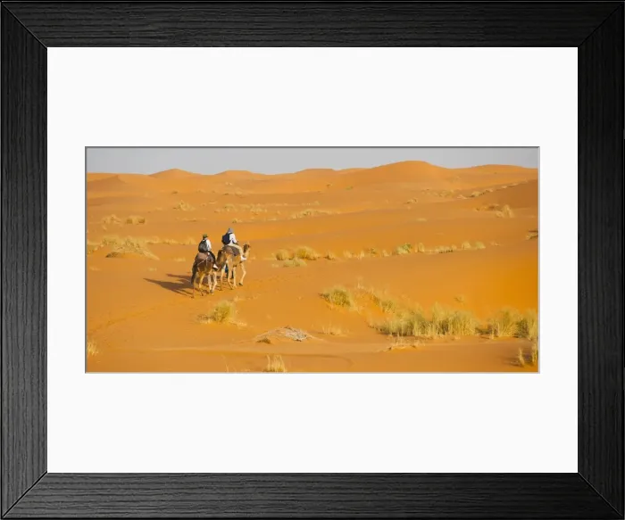 Framed Print : Tourist couple on a camel ride in Erg Chebbi Desert, Sahara Desert near Merzouga, Morocco, North Africa, Africa Framed Print : Tourist couple on a camel ride in Erg Chebbi Desert, Sahara Desert near Merzouga, Morocco, North Africa, Africa