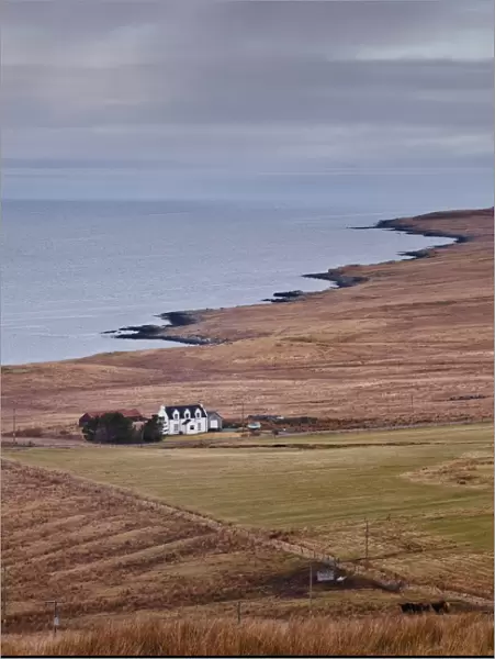 A solitary house sits on the north west coast of the Isle of Skye, Inner Hebrides, Scotland, United Kingdom, Europe