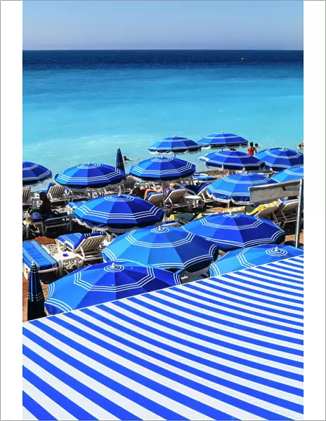 Beach parasols, Nice, Alpes Maritimes, Provence, Cote d Azur, French Riviera, France, Europe
