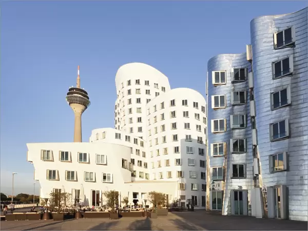 Rheinturm tower and Gehry Haus building, Medienhafen, Dusseldorf, North Rhine-Westphalia, Germany, Europe