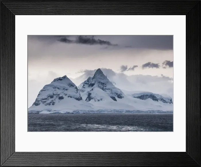 Framed Print : Dark clouds over the mountains and glaciers of Port Lockroy research station, Antarctica, Polar Regions Framed Print : Dark clouds over the mountains and glaciers of Port Lockroy research station, Antarctica, Polar Regions