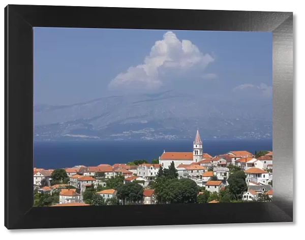 View of town with mainland in background, Postira, Brac Island, Dalmatian Coast, Croatia, Europe