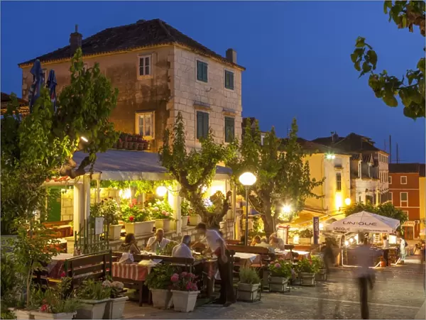 Restaurants at dusk, Makarska, Dalmatian Coast, Croatia, Europe
