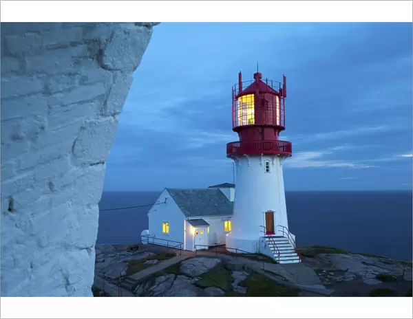 The idyllic Lindesnes Fyr Lighthouse illuminated at dusk, Lindesnes, Vest-Agder, Norway, Scandinavia, Europe