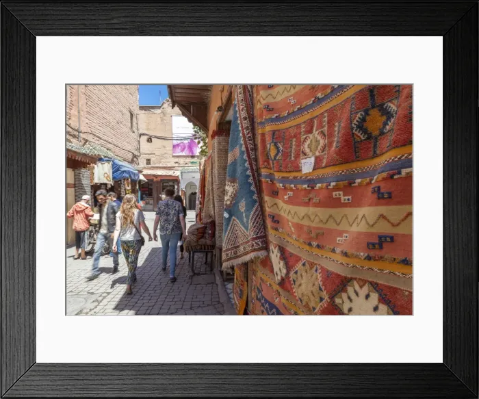 Framed Print : Tourists and locals walking alongside traditional rugs in the Medinas souks, Marrakech, Morocco, North Africa, Africa Framed Print : Tourists and locals walking alongside traditional rugs in the Medinas souks, Marrakech, Morocco, North Africa, Africa