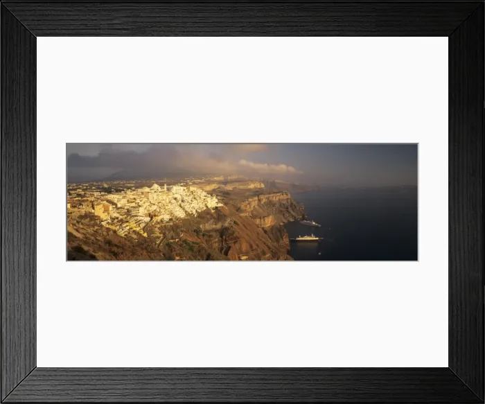 Framed Print : Panoramic image of Fira in the evening with cruiser and volcanic landscape, Santorini, Cyclades, Greek Islands, Greece, Europe Framed Print : Panoramic image of Fira in the evening with cruiser and volcanic landscape, Santorini, Cyclades, Greek Islands, Greece, Europe