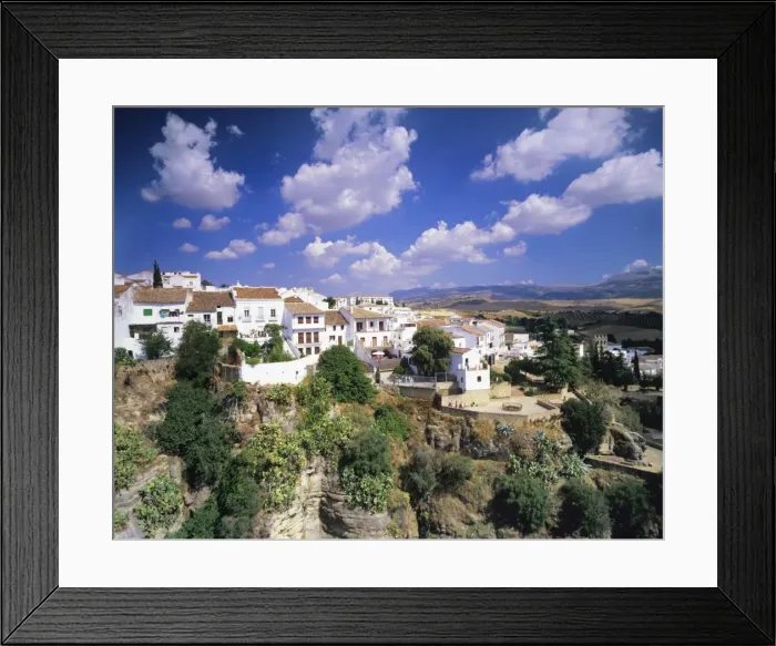 Framed Print : Houses on a gorge, old town of Ronda with cumulus clouds, Province Malaga, Andalusia, Spain, Europe Framed Print : Houses on a gorge, old town of Ronda with cumulus clouds, Province Malaga, Andalusia, Spain, Europe