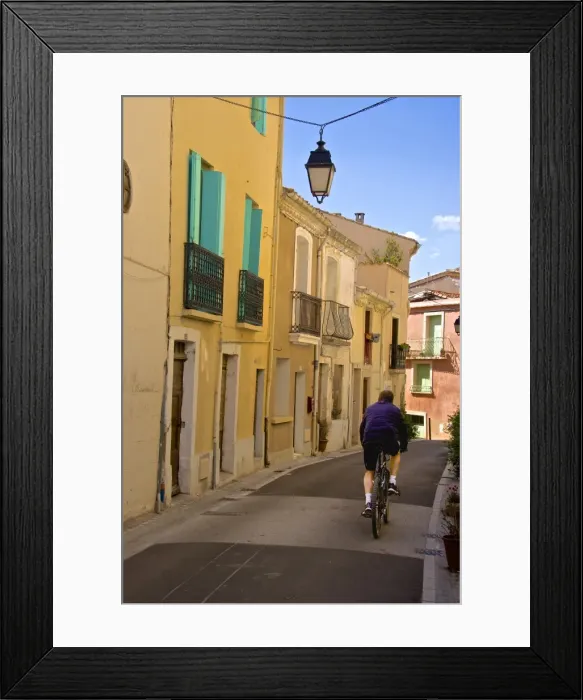 Framed Print : Street with cyclist, Old town, Bouzigues, Thau basin, Herault, Languedoc, France, Europe Framed Print : Street with cyclist, Old town, Bouzigues, Thau basin, Herault, Languedoc, France, Europe