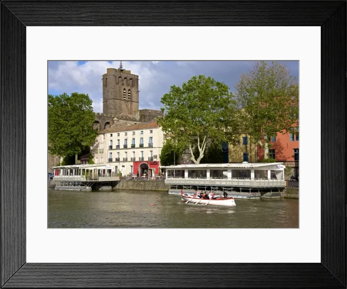 Framed Print : The fortified St. Etienne cathedral built of black lava and dating from the 12th century, and Herault river, Agde town, Haut Languedoc, France, Europe Framed Print : The fortified St. Etienne cathedral built of black lava and dating from the 12th century, and Herault river, Agde town, Haut Languedoc, France, Europe