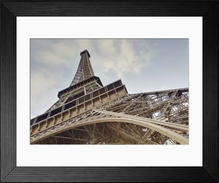 Framed Print : The Eiffel Tower towers overhead, Paris, France, Europe Framed Print : The Eiffel Tower towers overhead, Paris, France, Europe