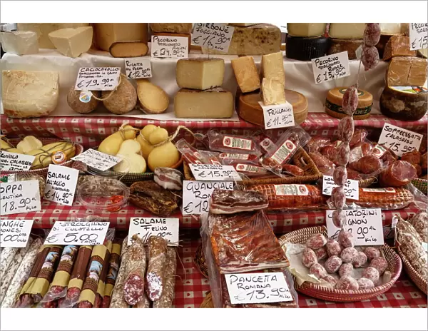 Cheese and salamis at Papiniano market, Milan, Lombardy, Italy, Europe