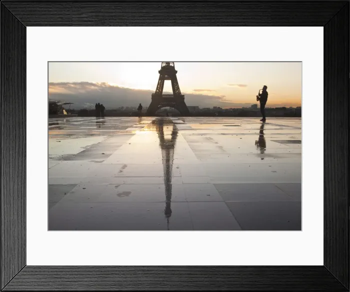 Framed Print : A man playing a saxophone in front of the Eiffel Tower, Paris, France, Europe Framed Print : A man playing a saxophone in front of the Eiffel Tower, Paris, France, Europe
