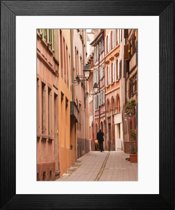 Framed Print : A man walks through La Petite France, Grande Ile, UNESCO World Heritage Site, Strasbourg, Bas-Rhin, Alsace, France, Europe Framed Print : A man walks through La Petite France, Grande Ile, UNESCO World Heritage Site, Strasbourg, Bas-Rhin, Alsace, France, Europe