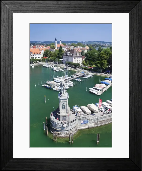 Framed Print : Aerial view from the lighthouse across the port and the old town with the sculpture of the Bavarian Lion, Lindau, Lake Constance (Bodensee), Bavaria, Germany, Europe Framed Print : Aerial view from the lighthouse across the port and the old town with the sculpture of the Bavarian Lion, Lindau, Lake Constance (Bodensee), Bavaria, Germany, Europe