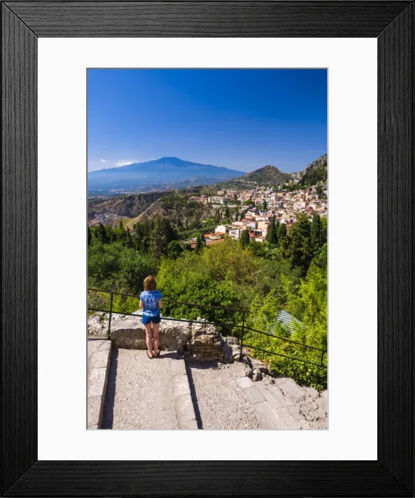 Framed Print : Tourist admiring the view of Mount Etna from Teatro Greco (Greek Theatre), Taormina, Sicily, Italy, Europe Framed Print : Tourist admiring the view of Mount Etna from Teatro Greco (Greek Theatre), Taormina, Sicily, Italy, Europe