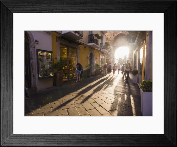 Framed Print : Tourists entering Corso Umberto, the main street in Taormina at sunset, Sicily, Italy, Europe Framed Print : Tourists entering Corso Umberto, the main street in Taormina at sunset, Sicily, Italy, Europe
