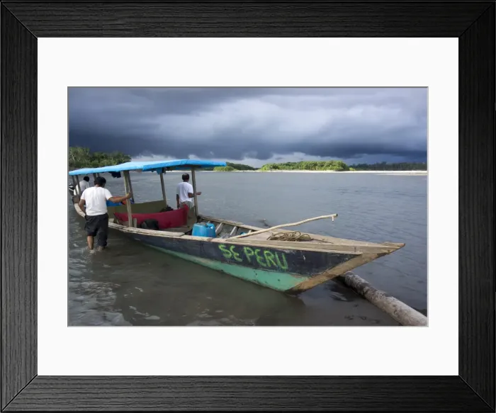 Framed Print : Dark clouds and tourist boat on the Manu river, Manu National Park, UNESCO World Heritage Site, Peru, South America Framed Print : Dark clouds and tourist boat on the Manu river, Manu National Park, UNESCO World Heritage Site, Peru, South America