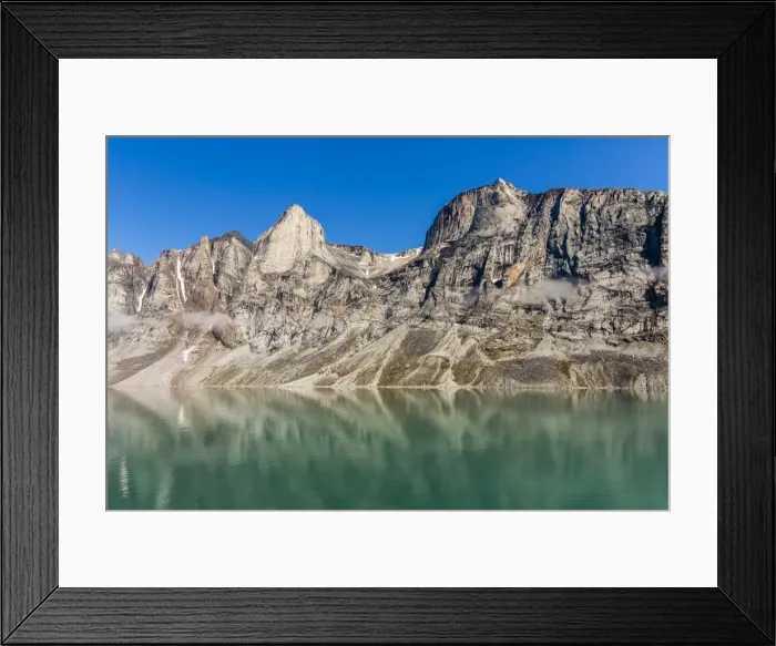 Framed Print : Reflections on a calm sea of the steep cliffs of Icy Arm, Baffin Island, Nunavut, Canada, North America