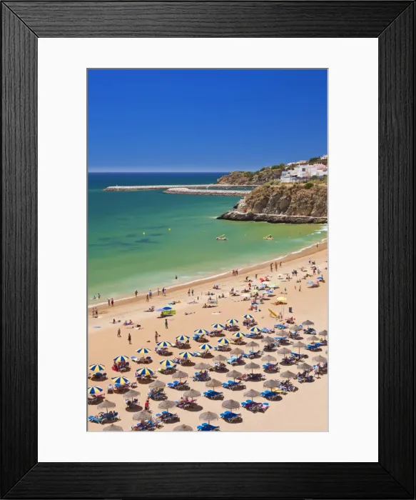 Framed Print : Holidaymakers sunbathing under beach umbrellas on the sandy beach at Praia do Tunel, Albufeira Beach, Algarve, Portugal, Europe Framed Print : Holidaymakers sunbathing under beach umbrellas on the sandy beach at Praia do Tunel, Albufeira Beach, Algarve, Portugal, Europe