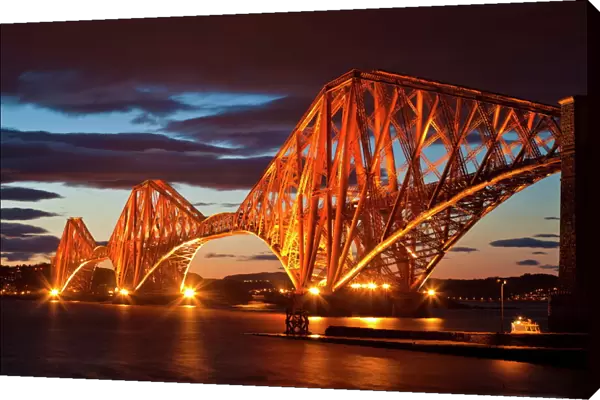Forth Rail Bridge over the River Forth illuminated at night, South Queensferry, Edinburgh, Midlothian, Scotland, United Kingdom, Europe