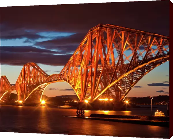 Forth Rail Bridge over the River Forth illuminated at night, South Queensferry, Edinburgh, Midlothian, Scotland, United Kingdom, Europe