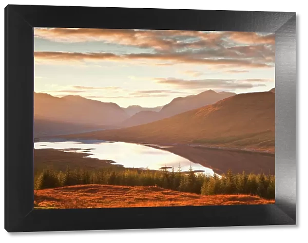 The setting sun over Loch Loyne in the Scottish Highlands, Scotland, United Kingdom, Europe