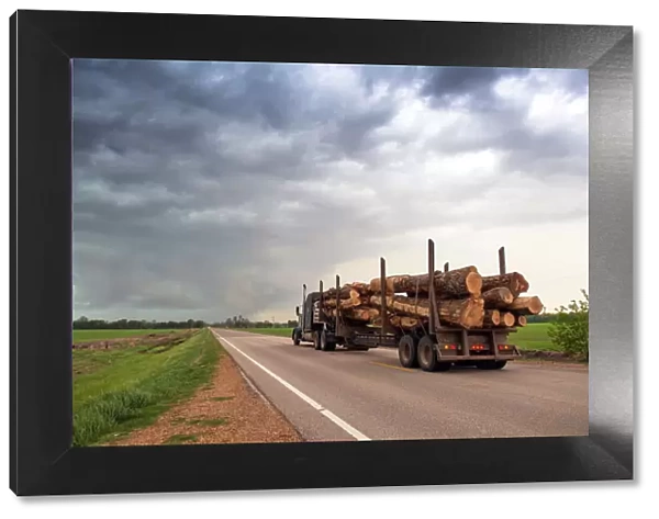 Logging truck in Mississippi driving into the heart of a thunderstorm with an extreme tornado watch, United States of America, North America