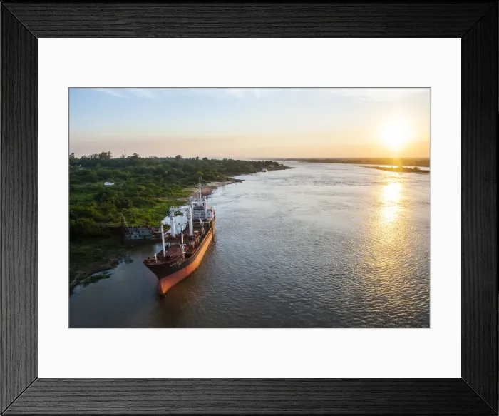 Framed Print : Cargo boat at sunset on the Asuncion River, Paraguay, South America Framed Print : Cargo boat at sunset on the Asuncion River, Paraguay, South America