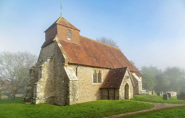 The 11th century Church of St. Mary The Virgin on a foggy winter morning, Friston, South Downs National Park, East Sussex, England, United Kingdom, Europe